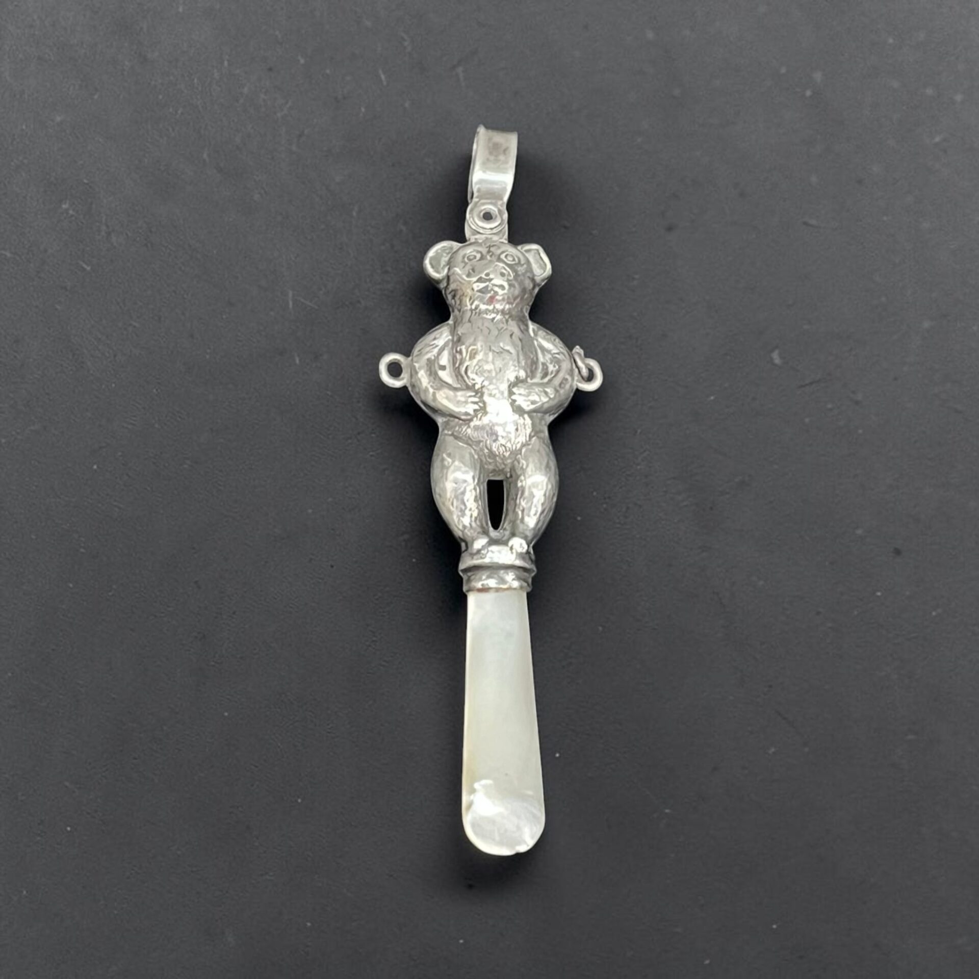 Silver & mother of pearl baby teether, Birmingham 1902 Crisford & Norris Ltd